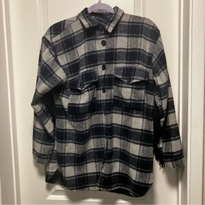 Pretty little thing women’s size small blue plaid Shacket with fringe on back